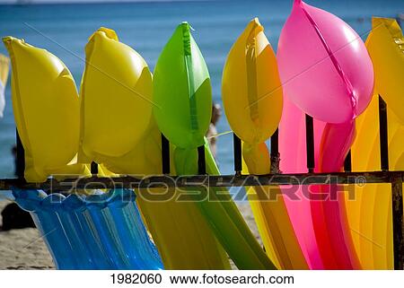 Hawaii, Oahu, Waikiki, close-up view of colorful plastic rafts View Large Photo Image Stock Image - Hawaii, Oahu, Waikiki, close-up view of colorful plastic rafts. Fotosearch