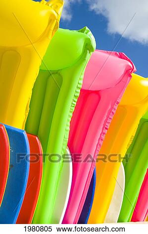 Hawaii, Oahu, Waikiki, Close-Up View Of Colorful Plastic Rafts And Boogie Boards. View Large Photo Image Stock Photography - Hawaii, Oahu, Waikiki, Close-Up View Of Colorful Plastic Rafts And Boogie Boards.. Fotosearch