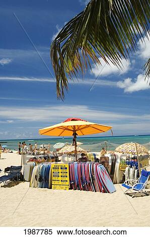 Stock Photography - Hawaii, Oahu, Waikiki, Colorful Beach Toy Rental Stand At Queens Beach. No Model Release. Fotosearch