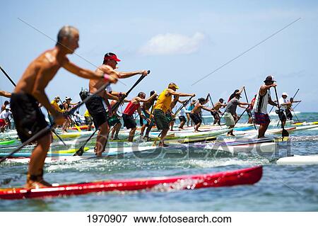 Stock Photo - Hawaii, Oahu, Waikiki, Competitors Of 'battle Of The Paddle' Start Off Strong. (Editorial Use Only). Fotosearch