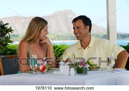 Hawaii, Oahu, Waikiki, Couple At A Restaurant, Diamond Head Background. View Large Photo Image Stock Image - Hawaii, Oahu, Waikiki, Couple At A Restaurant, Diamond Head Background.. Fotosearch