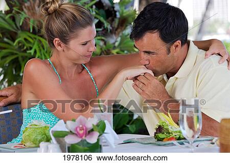 Stock Photograph - Hawaii, Oahu, Waikiki, Couple At A Restaurant, Diamond Head Background.. Fotosearch