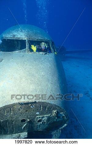 Hawaii, Oahu, Waikiki, Diver In Cockpit Of Plane Wreck Waving A80B View Large Photo Image Stock Image - Hawaii, Oahu, Waikiki, Diver In Cockpit Of Plane Wreck Waving A80B. Fotosearch
