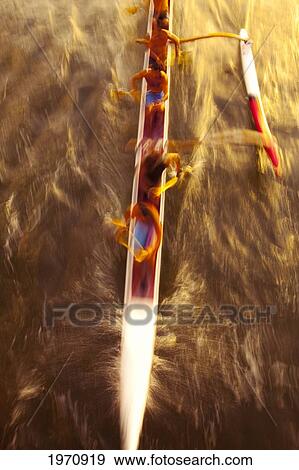 Hawaii, Oahu, Waikiki, Men Moving Quickly In An Outrigger Canoe On The Ala Wai. View Large Photo Image Stock Photo - Hawaii, Oahu, Waikiki, Men Moving Quickly In An Outrigger Canoe On The Ala Wai.. Fotosearch