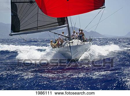 Hawaii, Oahu, Waikiki Offshore Series 2005, Sailboat On Blue Ocean, Land In Background. View Large Photo Image Stock Image - Hawaii, Oahu, Waikiki Offshore Series 2005, Sailboat On Blue Ocean, Land In Background.. Fotosearch