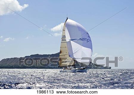 Hawaii, Oahu, Waikiki Offshore Series 2005, Sailboat On Blue Ocean, Land In Background. View Large Photo Image Stock Image - Hawaii, Oahu, Waikiki Offshore Series 2005, Sailboat On Blue Ocean, Land In Background.. Fotosearch