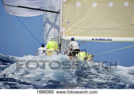 Stock Photo - Hawaii, Oahu, Waikiki Offshore Series 2005, Sailboat On Blue Ocean.. Fotosearch