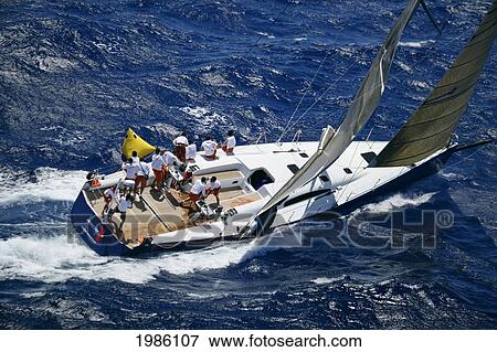 Hawaii, Oahu, Waikiki Offshore Series 2005, Sailboat On Blue Ocean. View Large Photo Image Stock Photo - Hawaii, Oahu, Waikiki Offshore Series 2005, Sailboat On Blue Ocean.. Fotosearch