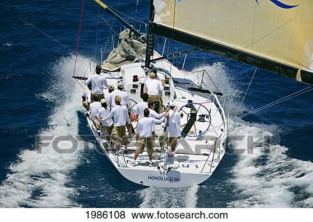 Stock Photo - Hawaii, Oahu, Waikiki Offshore Series 2005, Sailboat On Blue Ocean.. Fotosearch