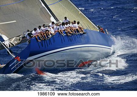 Stock Photo - Hawaii, Oahu, Waikiki Offshore Series 2005, Sailboat On Blue Ocean.. Fotosearch