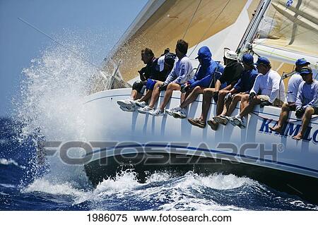 Hawaii, Oahu, Waikiki Offshore Series 2005, Sailboat On Blue Ocean, Big Splash. View Large Photo Image Stock Photography - Hawaii, Oahu, Waikiki Offshore Series 2005, Sailboat On Blue Ocean, Big Splash.. Fotosearch