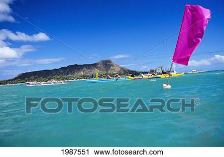 Hawaii, Oahu, Waikiki, Outrigger Canoes Pass By Flags In A Race, Diamond Head In Background. No Model Release View Large Photo Image Stock Image - Hawaii, Oahu, Waikiki, Outrigger Canoes Pass By Flags In A Race, Diamond Head In Background. No Model Release. Fotosearch