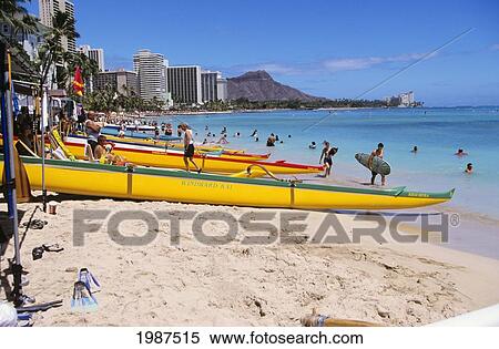 Hawaii, Oahu, Waikiki, Outrigger Canoes On Crowded Beach, Waikiki And Diamond Head In Background. View Large Photo Image Stock Photography - Hawaii, Oahu, Waikiki, Outrigger Canoes On Crowded Beach, Waikiki And Diamond Head In Background.. Fotosearch