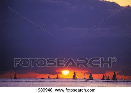 Hawaii, Oahu, Waikiki, Sailboats Silhouetted On Horizon At Sunset View Large Photo Image Stock Photo - Hawaii, Oahu, Waikiki, Sailboats Silhouetted On Horizon At Sunset. Fotosearch
