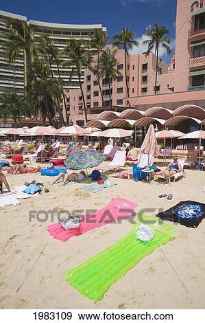 Hawaii, Oahu, Waikiki, Tourists On The Beach In Front Of The Royal Hawaiian Hotel. View Large Photo Image Stock Photo - Hawaii, Oahu, Waikiki, Tourists On The Beach In Front Of The Royal Hawaiian Hotel.. Fotosearch