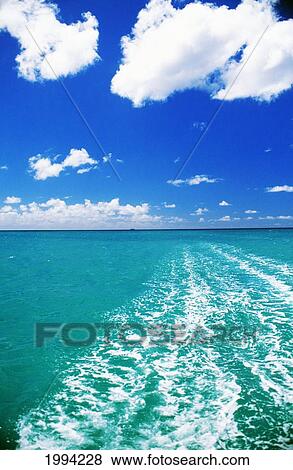Hawaii, Oahu, Waikiki, Turquoise Ocean With Boat Wake, Blue Sky View Large Photo Image Stock Photo - Hawaii, Oahu, Waikiki, Turquoise Ocean With Boat Wake, Blue Sky. Fotosearch