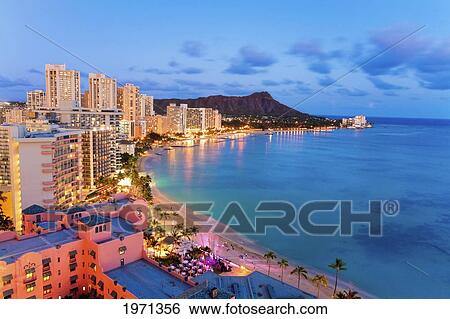 Hawaii, Oahu, Waikiki, View Of Hotels Along Ocean And Diamond Head In The Evening. View Large Photo Image Stock Photograph - Hawaii, Oahu, Waikiki, View Of Hotels Along Ocean And Diamond Head In The Evening.. Fotosearch
