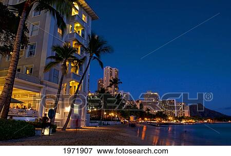 Hawaii, Oahu, Waikiki, Waikiki Beach At Night With Veiw Of City Lights And Diamond Head In Background. View Large Photo Image Stock Photo - Hawaii, Oahu, Waikiki, Waikiki Beach At Night With Veiw Of City Lights And Diamond Head In Background.. Fotosearch