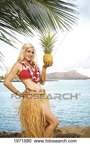 Hawaii, Oahu, Waikiki, Woman In Vintage-Style Hula Outfit Holding Pineapple Along Beach, Diamond Head In The Distance. View Large Photo Image Stock Image - Hawaii, Oahu, Waikiki, Woman In Vintage-Style Hula Outfit Holding Pineapple Along Beach, Diamond Head In The Distance.. Fotosearch