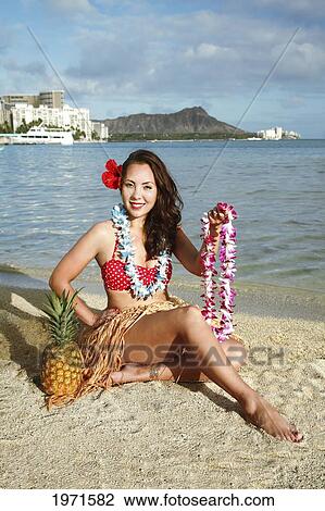 Hawaii, Oahu, Waikiki, Woman In Vintage-Style Hula Outfit Holding Lei Along Beach, Diamond Head In The Distance. View Large Photo Image Stock Image - Hawaii, Oahu, Waikiki, Woman In Vintage-Style Hula Outfit Holding Lei Along Beach, Diamond Head In The Distance.. Fotosearch