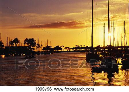 Stock Photograph - Hawaii, Oahu, Waikiki Yacht Harbor At Sunset.. Fotosearch