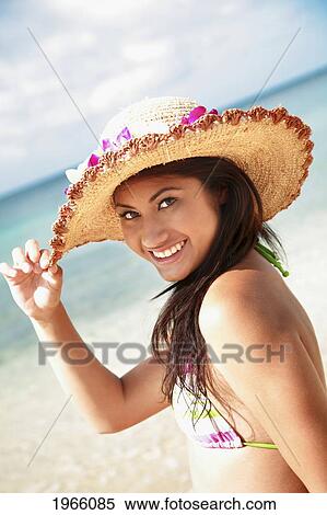 Hawaii, Oahu, Waikiki, Young Woman Modeling Hat At Beach. View Large Photo Image Stock Photography - Hawaii, Oahu, Waikiki, Young Woman Modeling Hat At Beach.. Fotosearch