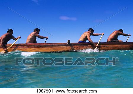 Stock Image - Hawaii, Oahu, Waimanalo Bay, Men's Paddling Team In Koa Canoe Regatta For Men, View From Side. No Model Release. Fotosearch