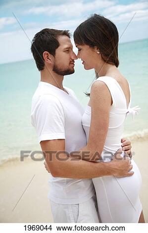 Picture - Hawaii, Oahu, Waimanalo, Young Couple In Love Gazing Into Each Other. Fotosearch