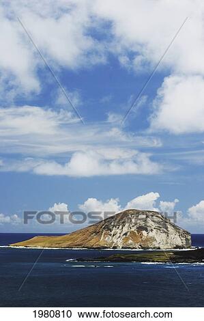 Hawaii, Oahu, Windward, Waimanalo, Rabbit Island, Calm Blue Ocean, Cloudy Blue Sky. View Large Photo Image Stock Image - Hawaii, Oahu, Windward, Waimanalo, Rabbit Island, Calm Blue Ocean, Cloudy Blue Sky.. Fotosearch