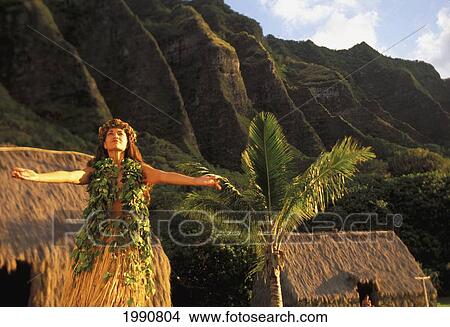 Hawaii, Oahu, Woman Dancing Hula With Ko'olau Mountains, Grass Shacks, Palm Tree View Large Photo Image Picture - Hawaii, Oahu, Woman Dancing Hula With Ko'olau Mountains, Grass Shacks, Palm Tree. Fotosearch