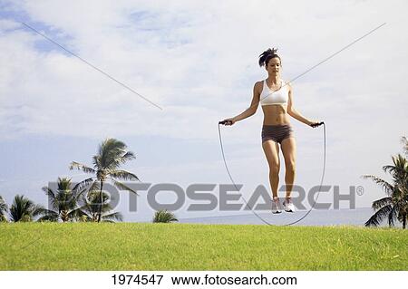 Hawaii, Oahu, Woman Excercising With Jump Rope. View Large Photo Image Stock Photo - Hawaii, Oahu, Woman Excercising With Jump Rope.. Fotosearch