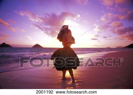 Stock Image - Hawaii, Oahu, Woman Hula At Sunrise Plumeria Lei Mokulua Islands Background Tropical. Fotosearch