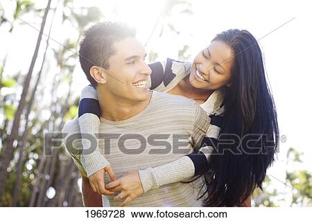 Stock Photo - Hawaii, Oahu, Young Couple Enjoying A Day Outdoors.. Fotosearch