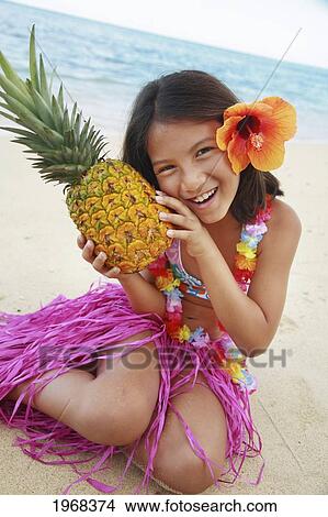 Picture - Hawaii, Oahu, Young Girl Holding A Pineapple.. Fotosearch