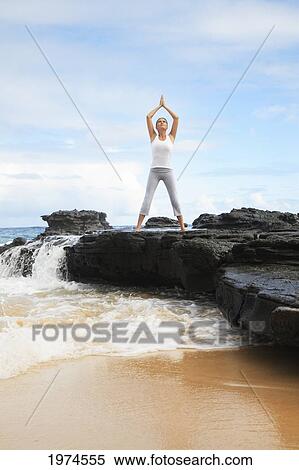 Hawaii, Oahu, Young Girl On The Beach Excercising. View Large Photo Image Stock Photography - Hawaii, Oahu, Young Girl On The Beach Excercising.. Fotosearch