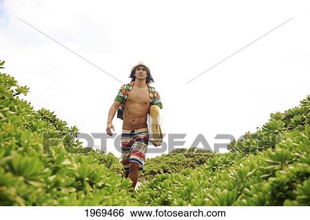Hawaii, Oahu, Young Man At The Beach With Surfboard. View Large Photo Image Stock Photograph - Hawaii, Oahu, Young Man At The Beach With Surfboard.. Fotosearch