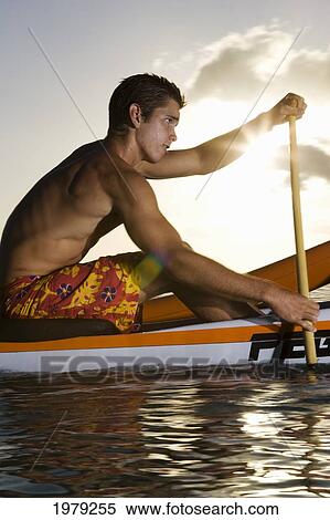 Hawaii, Oahu, Young Man Paddling A One Man Canoe. View Large Photo Image Stock Photography - Hawaii, Oahu, Young Man Paddling A One Man Canoe.. Fotosearch