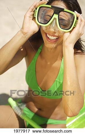 Hawaii, Oahu, Young Woman Laughing With Snorkel Gear, Sitting On Beach. View Large Photo Image Stock Photo - Hawaii, Oahu, Young Woman Laughing With Snorkel Gear, Sitting On Beach.. Fotosearch