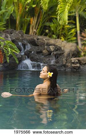 Hawaii, Oahu, Young Woman Relaxing In Tropical Pool. View Large Photo Image Stock Photograph - Hawaii, Oahu, Young Woman Relaxing In Tropical Pool.. Fotosearch