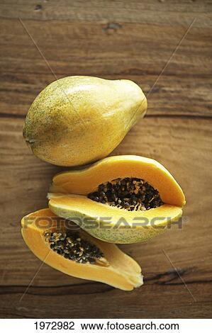 Hawaii, Papaya Fruit On Wooden Table Top. View Large Photo Image Stock Image - Hawaii, Papaya Fruit On Wooden Table Top.. Fotosearch