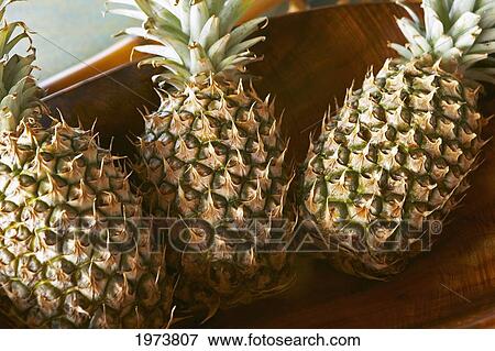 Stock Photo - Hawaii, Platter Of Large Pineapples.. Fotosearch