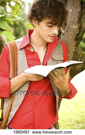 Hawaii, Portrait Of A European Male Model In Travel Attire. View Large Photo Image Stock Photo - Hawaii, Portrait Of A European Male Model In Travel Attire.. Fotosearch