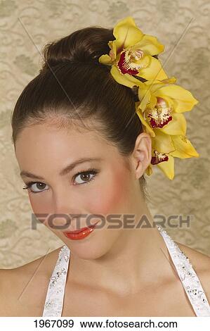 Hawaii, Portrait Of Young Woman With Orchids In Hair. View Large Photo Image Stock Photo - Hawaii, Portrait Of Young Woman With Orchids In Hair.. Fotosearch