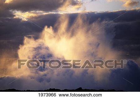 Stock Photograph - Hawaii, Powerful Wave Crashes On Rocky Shoreline.. Fotosearch