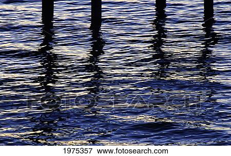 Stock Photo - Hawaii, Reflections On Blue Water And Pier Stilts.. Fotosearch