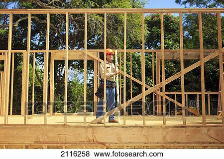 Stock Photo - Hawaii, Senior male construction worker at a construction site.. Fotosearch