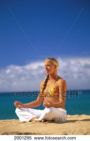 Stock Photography - Hawaii, Side Angle Of Woman On Beach Yoga, Eyes Closed Meditation. Fotosearch