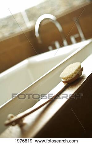Stock Photo - Hawaii, Soft Peaceful Interior Bathroom With White Tub And Scrubber.. Fotosearch