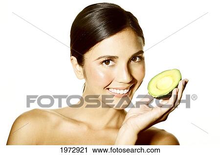 Hawaii, Studio Headshot Of A Beautiful Girl Holding An Avocado. View Large Photo Image Stock Image - Hawaii, Studio Headshot Of A Beautiful Girl Holding An Avocado.. Fotosearch