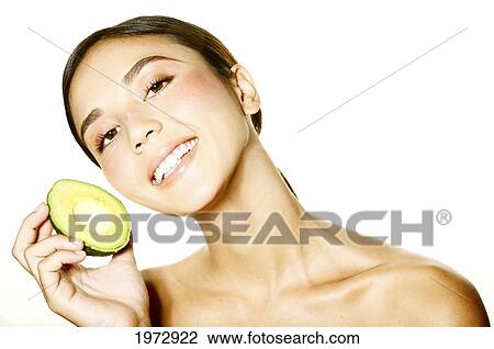 Hawaii, Studio Headshot Of A Beautiful Girl Holding An Avocado. View Large Photo Image Stock Image - Hawaii, Studio Headshot Of A Beautiful Girl Holding An Avocado.. Fotosearch